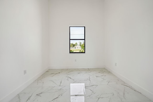418 NE 31st Ter, Cape Coral, FL 33909 - spare room with baseboards and marble finish floors