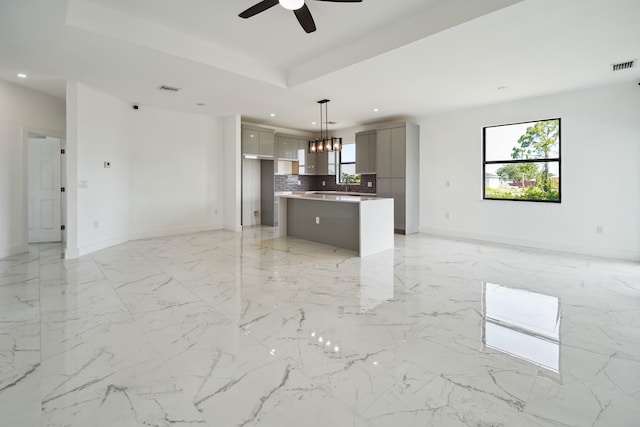 418 NE 31st Ter, Cape Coral, FL 33909 - unfurnished living room with recessed lighting, ceiling fan, baseboards, and plenty of natural light