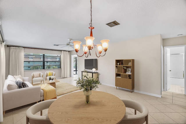 1801 Indian River Blvd Unit B8, Vero Beach, FL 32960 - dining room featuring a chandelier, light tile patterned floors, baseboards, and a textured ceiling