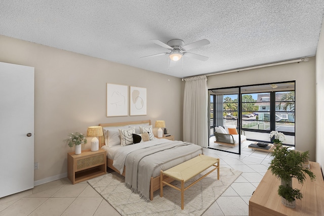 1801 Indian River Blvd Unit B8, Vero Beach, FL 32960 - bedroom featuring light tile patterned floors, a textured ceiling, ceiling fan, and access to outside