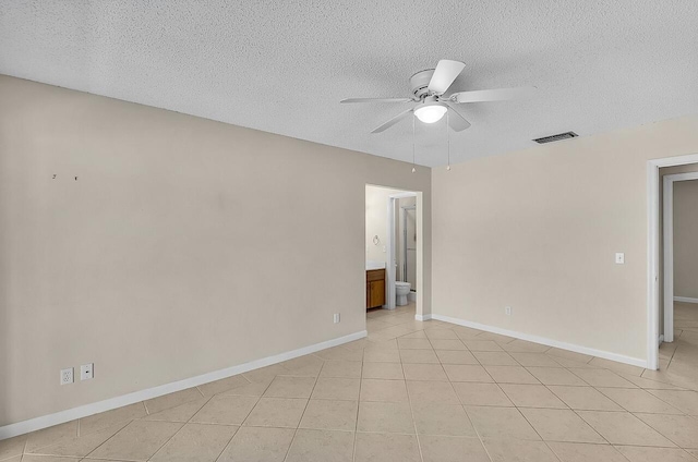 1801 Indian River Blvd Unit B8, Vero Beach, FL 32960 - spare room featuring ceiling fan, a textured ceiling, baseboards, and light tile patterned flooring