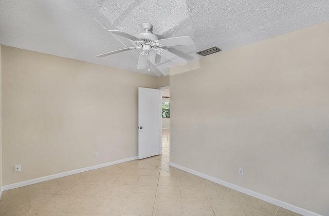 1801 Indian River Blvd Unit B8, Vero Beach, FL 32960 - unfurnished room featuring a ceiling fan, a textured ceiling, light tile patterned flooring, and baseboards