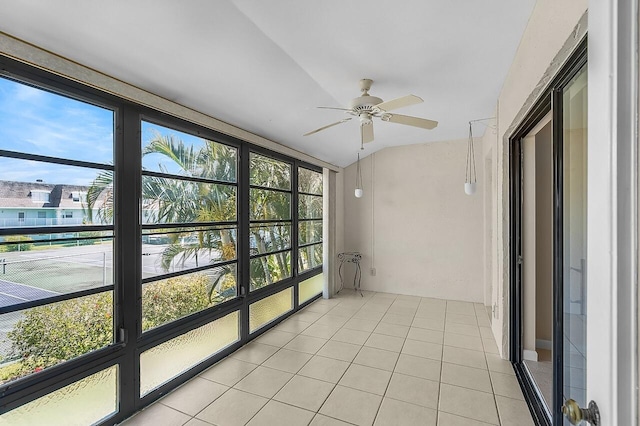 1801 Indian River Blvd Unit B8, Vero Beach, FL 32960 - unfurnished sunroom with a ceiling fan, tile patterned floors, and vaulted ceiling