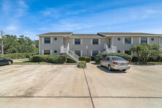 1801 Indian River Blvd Unit B8, Vero Beach, FL 32960 - multi unit property featuring stairs, uncovered parking, and stucco siding