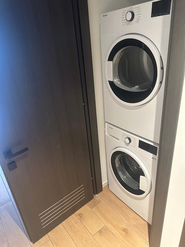 398 NE 5th St Unit 2503, Miami, FL 33132 - laundry room with stacked washing machine and dryer and light wood-style floors
