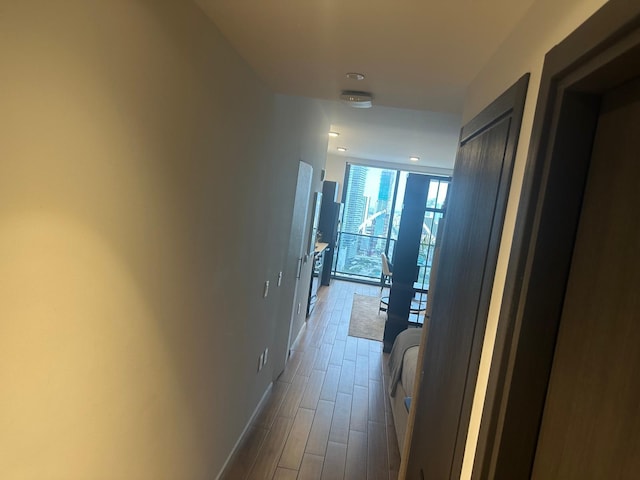 398 NE 5th St Unit 2503, Miami, FL 33132 - hallway featuring wood finished floors and baseboards
