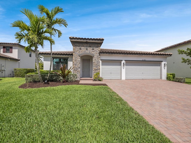 3181 Streng Ln, Royal Palm Beach, FL 33411 - mediterranean / spanish house with decorative driveway, stone siding, an attached garage, stucco siding, and a front yard
