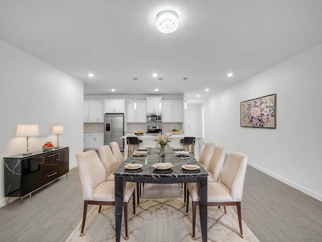 3181 Streng Ln, Royal Palm Beach, FL 33411 - dining room featuring light wood-style flooring, baseboards, and recessed lighting