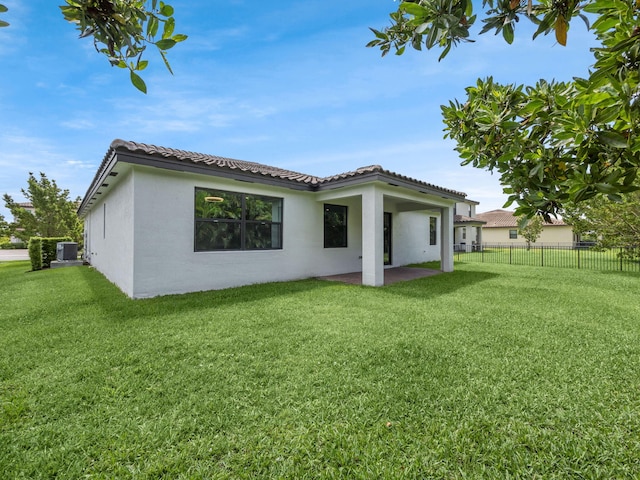 3181 Streng Ln, Royal Palm Beach, FL 33411 - rear view of property with a tile roof, a patio, stucco siding, and cooling unit