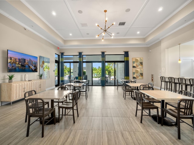 3181 Streng Ln, Royal Palm Beach, FL 33411 - dining area featuring a chandelier, crown molding, a raised ceiling, and a high ceiling