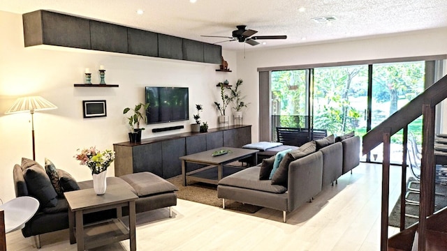 4344 Carambola Cir Unit F707, Coconut Creek, FL 33066 - living room with ceiling fan, light wood finished floors, recessed lighting, and a textured ceiling