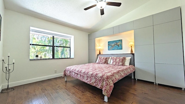 4344 Carambola Cir Unit F707, Coconut Creek, FL 33066 - bedroom with lofted ceiling, dark wood-style floors, baseboards, ceiling fan, and a textured ceiling