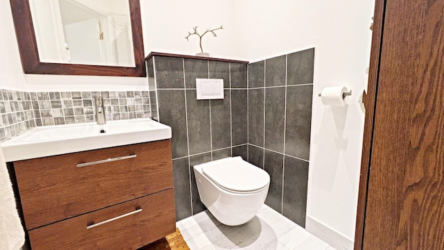 4344 Carambola Cir Unit F707, Coconut Creek, FL 33066 - half bathroom with vanity, tile walls, and toilet