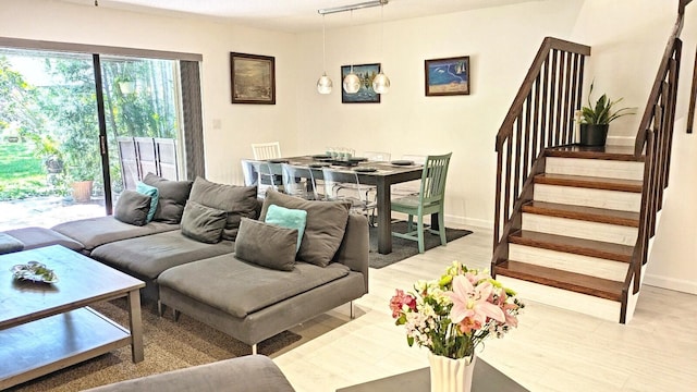 4344 Carambola Cir Unit F707, Coconut Creek, FL 33066 - living room with light wood finished floors, stairs, and baseboards