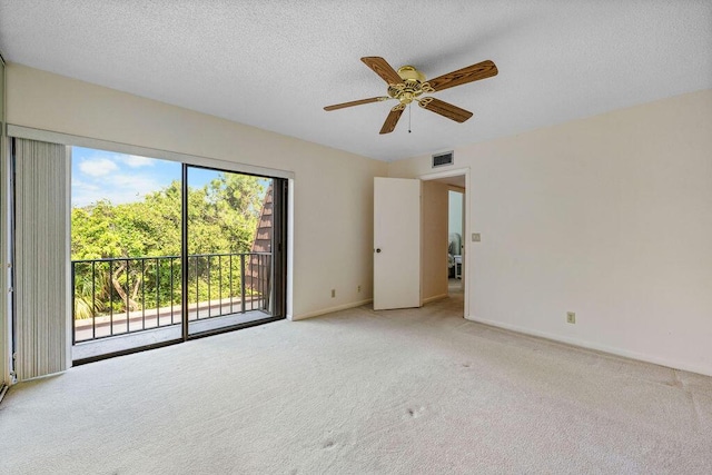 5642 SE Riverboat Dr Unit A5-120, Stuart, FL 34997 - carpeted spare room featuring ceiling fan, baseboards, and a textured ceiling