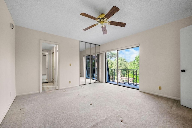 5642 SE Riverboat Dr Unit A5-120, Stuart, FL 34997 - spare room featuring carpet flooring, ceiling fan, a textured ceiling, and baseboards