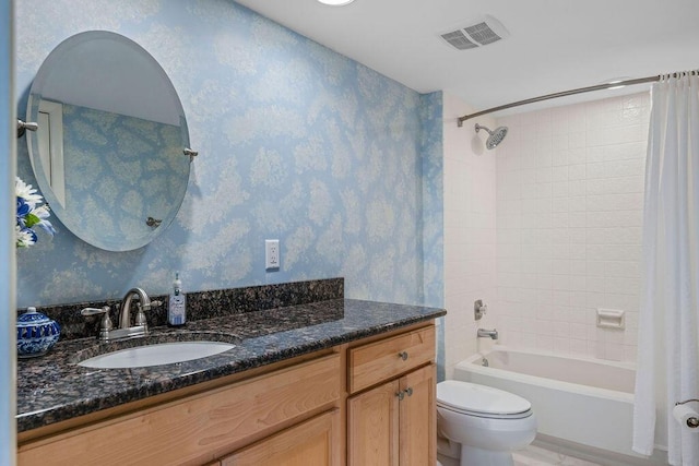 5642 SE Riverboat Dr Unit A5-120, Stuart, FL 34997 - bathroom with vanity, toilet, shower / bathtub combination with curtain, and wallpapered walls