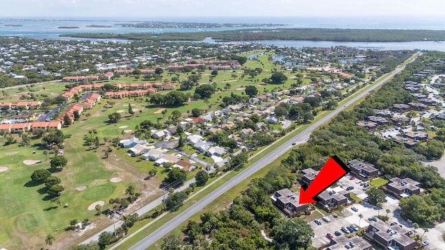 5642 SE Riverboat Dr Unit A5-120, Stuart, FL 34997 - aerial overview of property's location with a nearby body of water, a golf course, and nearby suburban area