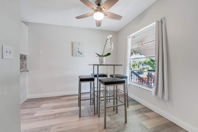 5890 Sugar Palm Ct Unit E, Delray Beach, FL 33484 - dining space with wood finished floors, ceiling fan, and baseboards