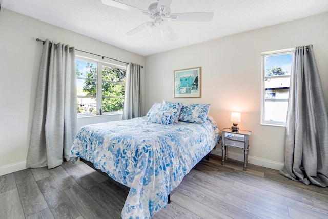 5890 Sugar Palm Ct Unit E, Delray Beach, FL 33484 - bedroom featuring wood finished floors, baseboards, and ceiling fan