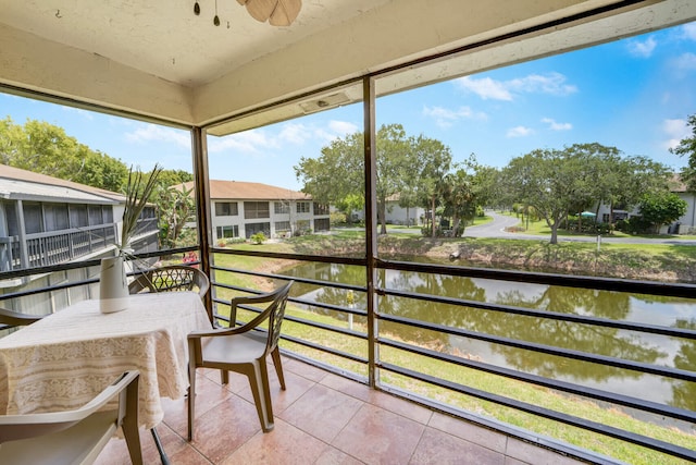 5890 Sugar Palm Ct Unit E, Delray Beach, FL 33484 - sunroom featuring a water view