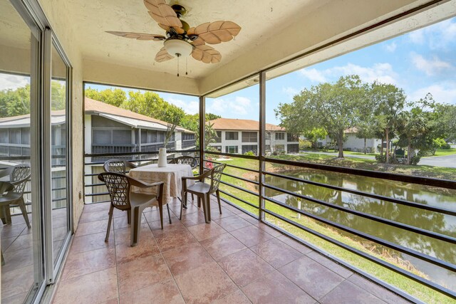 5890 Sugar Palm Ct Unit E, Delray Beach, FL 33484 - sunroom featuring ceiling fan and a residential view
