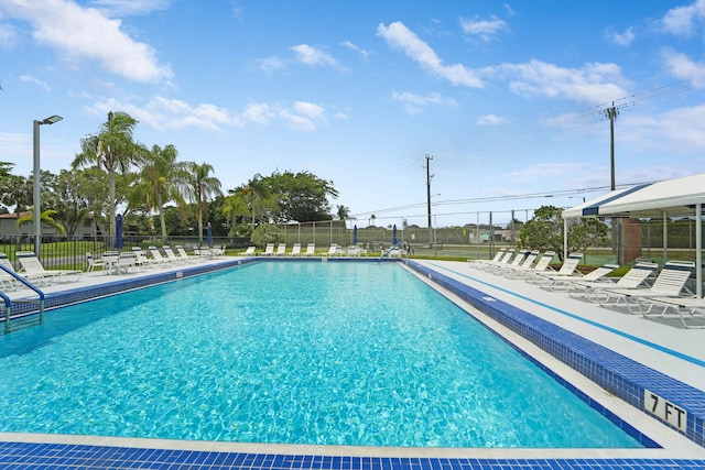 5890 Sugar Palm Ct Unit E, Delray Beach, FL 33484 - community pool featuring a patio area