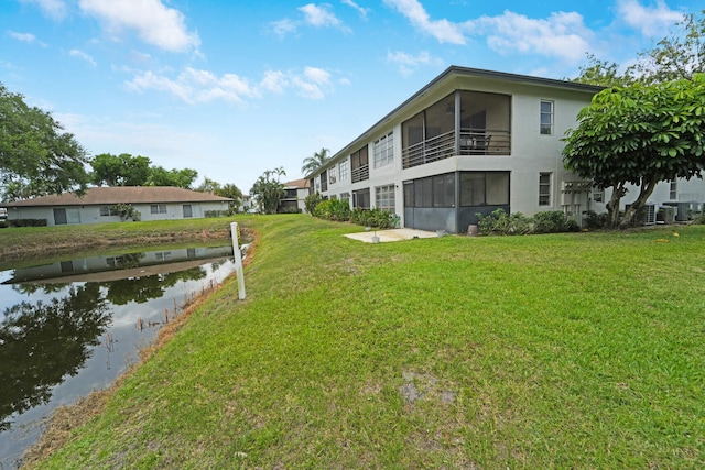 5890 Sugar Palm Ct Unit E, Delray Beach, FL 33484 - dock area featuring a yard and central AC