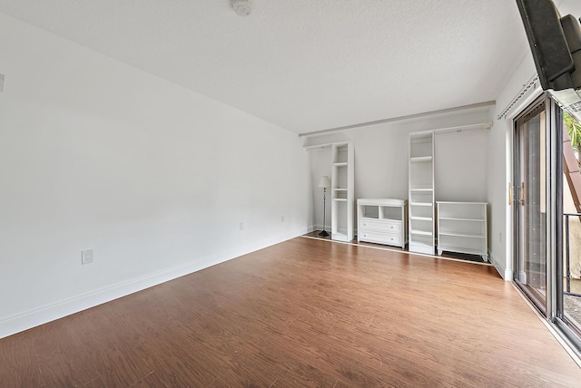 1021 10th Ct Unit 1021, Palm Beach Gardens, FL 33410 - unfurnished bedroom featuring wood finished floors, baseboards, and access to outside