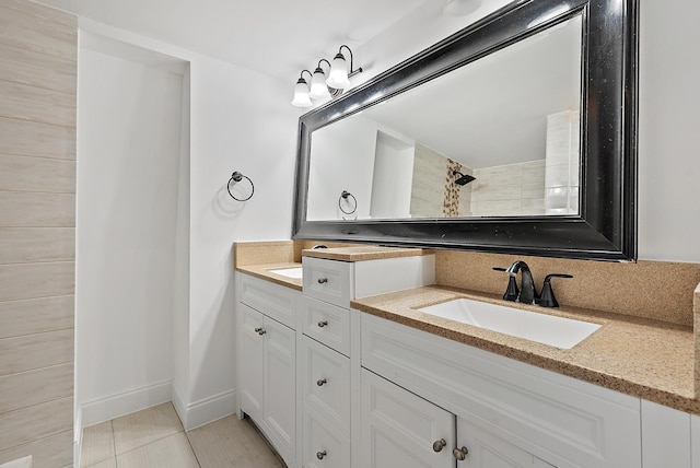 1021 10th Ct Unit 1021, Palm Beach Gardens, FL 33410 - bathroom with double vanity and baseboards