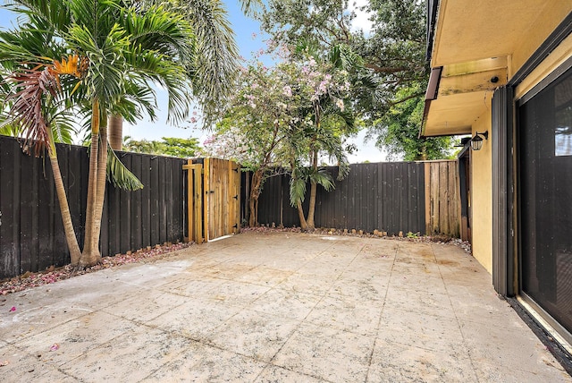 1021 10th Ct Unit 1021, Palm Beach Gardens, FL 33410 - fenced backyard featuring a patio