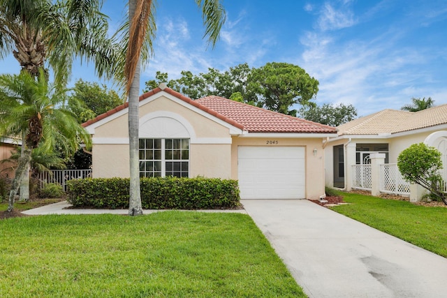 2045 SW Olympic Club Ter, Palm City, FL 34990 - mediterranean / spanish home featuring an attached garage, stucco siding, a tile roof, and concrete driveway