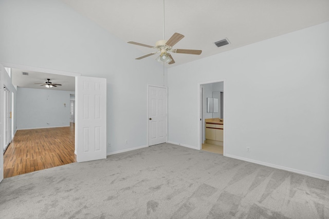 2045 SW Olympic Club Ter, Palm City, FL 34990 - unfurnished room featuring carpet floors, a ceiling fan, high vaulted ceiling, and baseboards