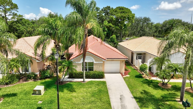 2045 SW Olympic Club Ter, Palm City, FL 34990 - mediterranean / spanish-style home featuring a tile roof, stucco siding, concrete driveway, an attached garage, and a front lawn