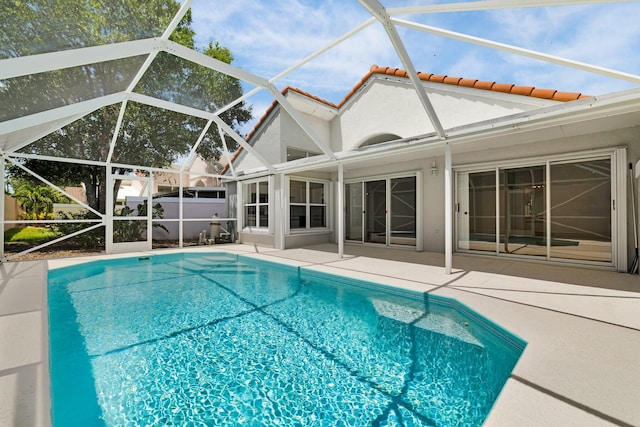 2281 SW Olympic Club Ter, Palm City, FL 34990 - outdoor pool with a patio area and a lanai