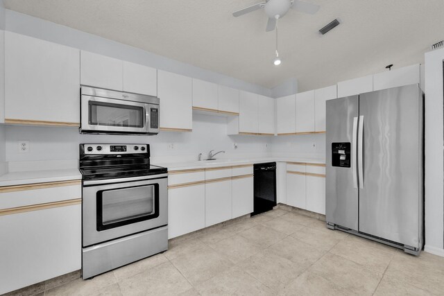 2281 SW Olympic Club Ter, Palm City, FL 34990 - kitchen featuring stainless steel appliances, light countertops, a ceiling fan, light tile patterned floors, and a sink