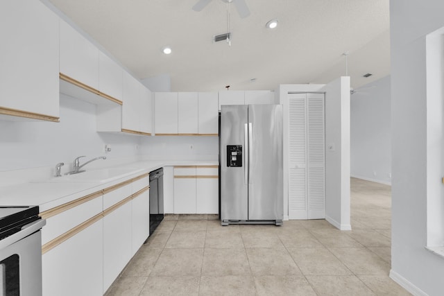 2281 SW Olympic Club Ter, Palm City, FL 34990 - kitchen featuring stainless steel appliances, ceiling fan, a sink, light countertops, and white cabinets