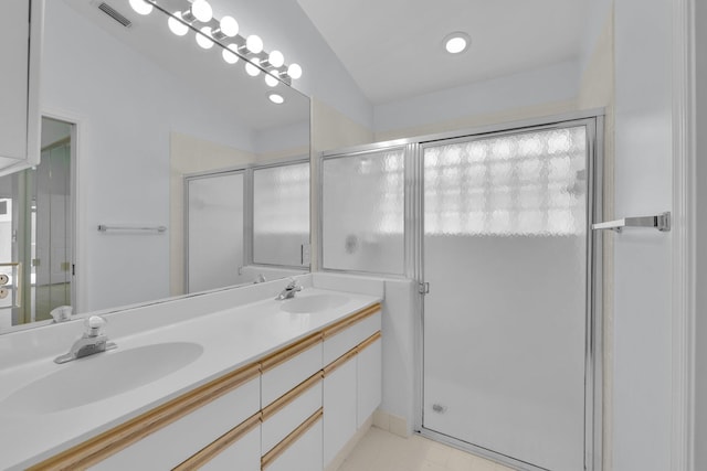 2281 SW Olympic Club Ter, Palm City, FL 34990 - bathroom featuring double vanity and a shower stall