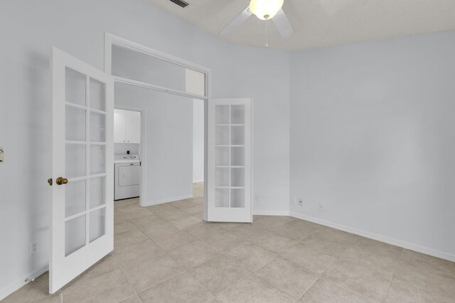 2281 SW Olympic Club Ter, Palm City, FL 34990 - unfurnished bedroom with french doors, washer / clothes dryer, light tile patterned flooring, and a ceiling fan