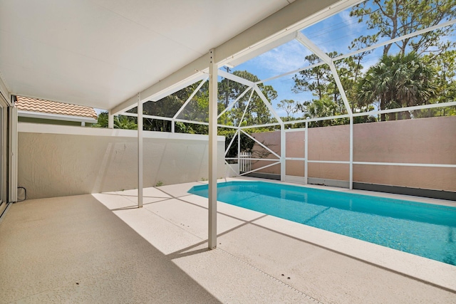 2281 SW Olympic Club Ter, Palm City, FL 34990 - view of swimming pool with a patio and a lanai