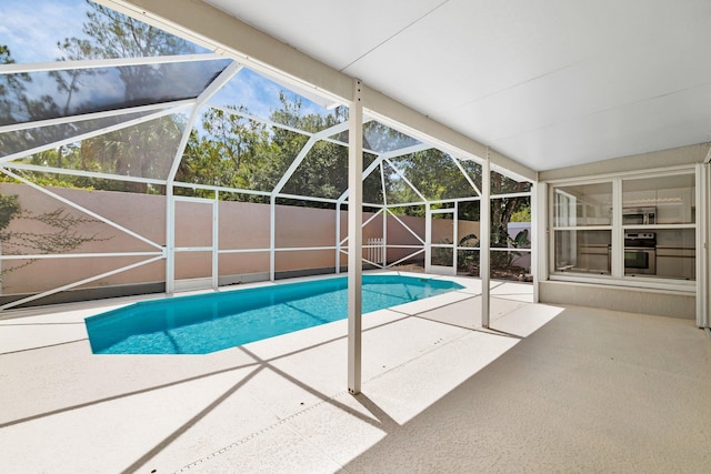 2281 SW Olympic Club Ter, Palm City, FL 34990 - view of pool with a patio area, a fenced backyard, and a lanai