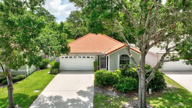 2281 SW Olympic Club Ter, Palm City, FL 34990 - mediterranean / spanish-style home featuring a tiled roof, concrete driveway, stucco siding, an attached garage, and a front yard