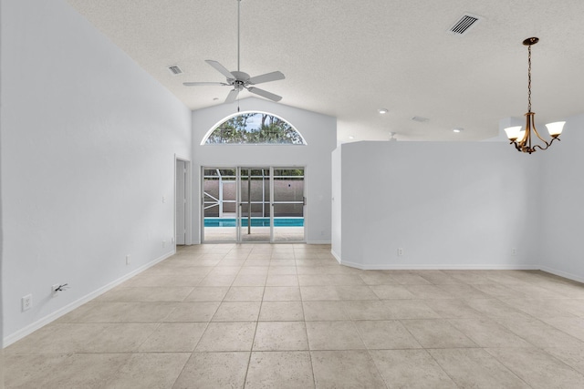 2281 SW Olympic Club Ter, Palm City, FL 34990 - unfurnished room featuring ceiling fan, vaulted ceiling, a textured ceiling, a chandelier, and baseboards
