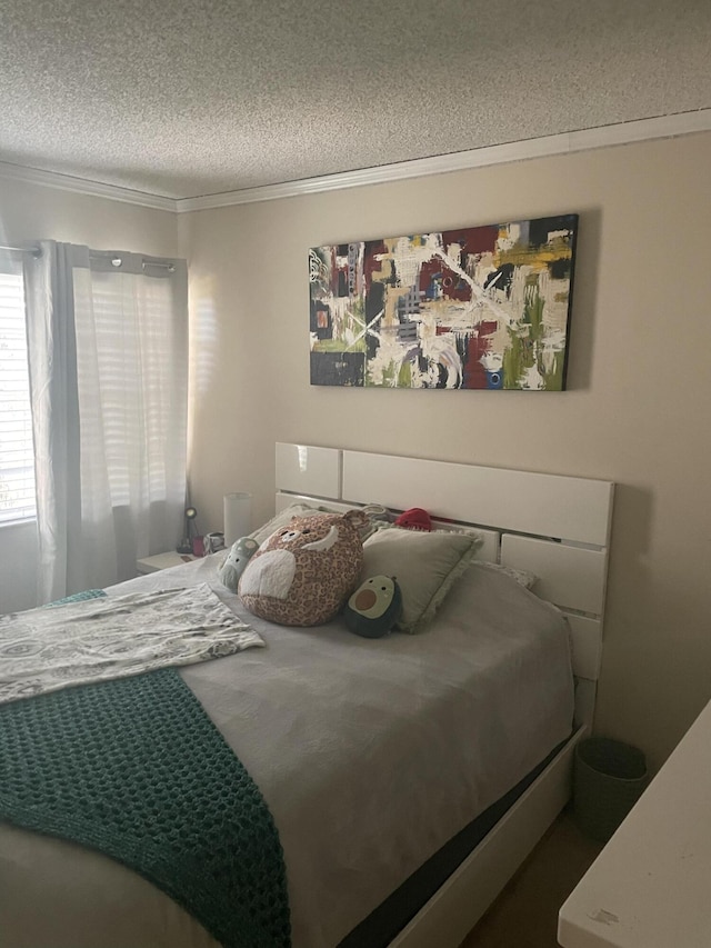 1701 Village Blvd Unit 112, West Palm Beach, FL 33409 - bedroom featuring a textured ceiling and crown molding