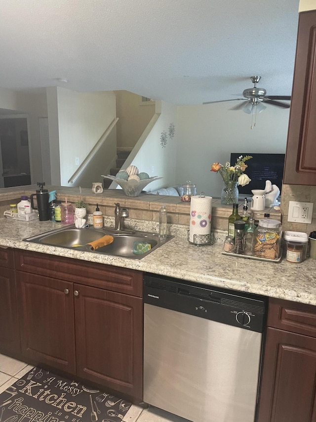 1701 Village Blvd Unit 112, West Palm Beach, FL 33409 - kitchen with dishwasher, a sink, ceiling fan, light countertops, and light tile patterned flooring