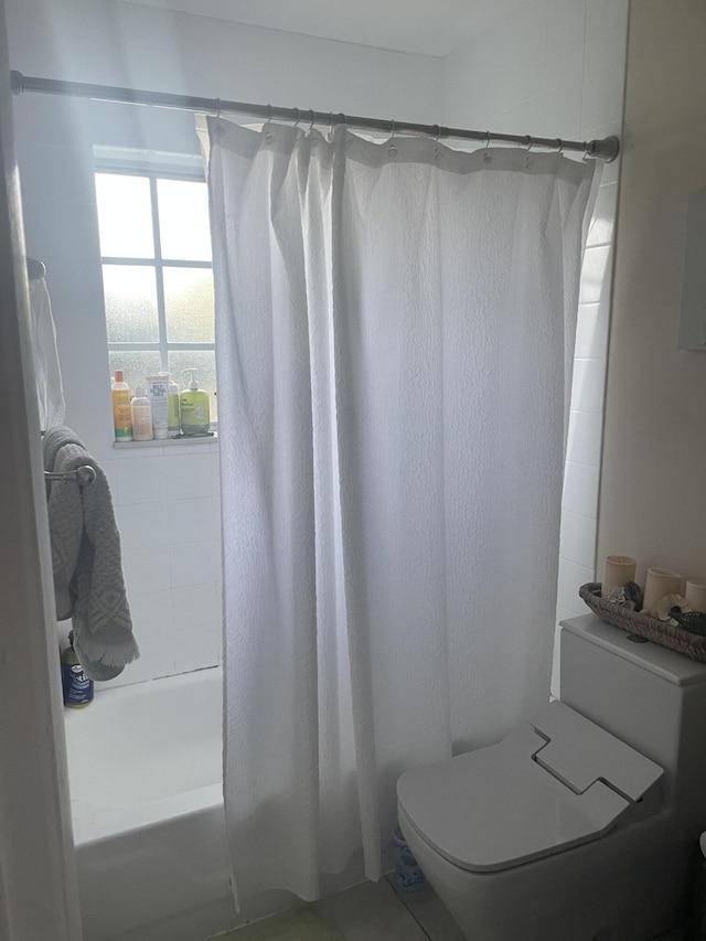 1701 Village Blvd Unit 112, West Palm Beach, FL 33409 - full bathroom featuring shower / bath combo and toilet