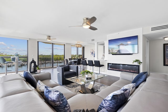 899 Jeffery St Unit 414, Boca Raton, FL 33487 - living area featuring ceiling fan, floor to ceiling windows, and wood finished floors