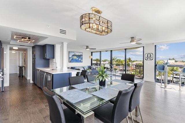 899 Jeffery St Unit 414, Boca Raton, FL 33487 - dining room featuring a ceiling fan, baseboards, dark wood finished floors, expansive windows, and wine cooler