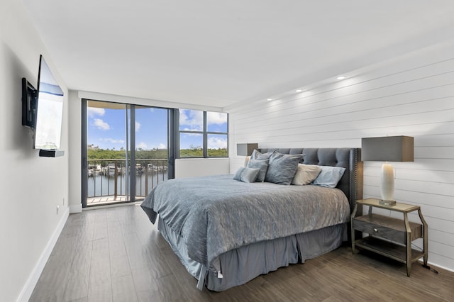 899 Jeffery St Unit 414, Boca Raton, FL 33487 - bedroom with baseboards, access to outside, wood finished floors, and wood walls