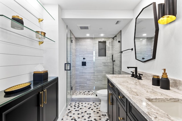 899 Jeffery St Unit 414, Boca Raton, FL 33487 - bathroom featuring double vanity, toilet, a shower stall, and recessed lighting